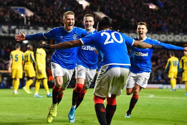 Rangers players celebrate Steven Davis' goal in the win over Porto. Picture: SNS
