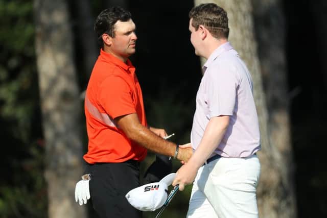 Playing partner Patrick Reed congratulates Bob MacIntyre on his round of 63 after the second day of the Turkish Airlines Open. Picture: Warren Little/Getty Images