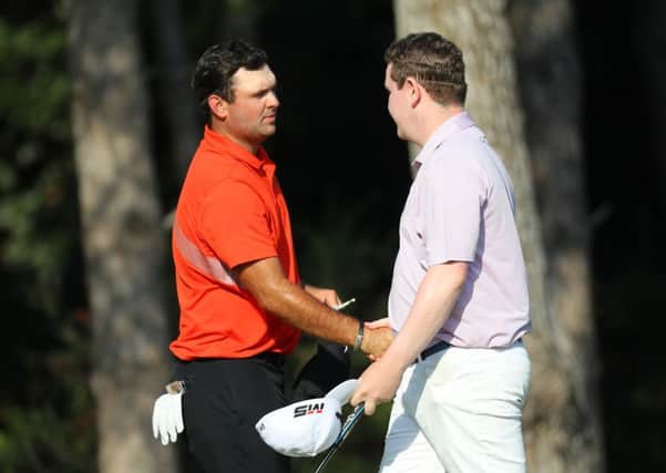 Playing partner Patrick Reed congratulates Bob MacIntyre on his round of 63 after the second day of the Turkish Airlines Open. Picture: Warren Little/Getty Images