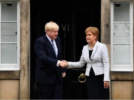 The first time Boris Johnson visited Scotland,he washeckled by protesters, forcing him to leave a meeting via the backdoor. Picture: Getty Images/ Jeff Mitchell