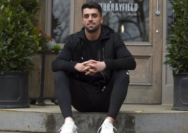 Adam Hastings, sitting outside the Murrayfield Hotel in Edinburgh, is gearing up for a big year with Glasgow Warriors. Picture: Lisa Ferguson