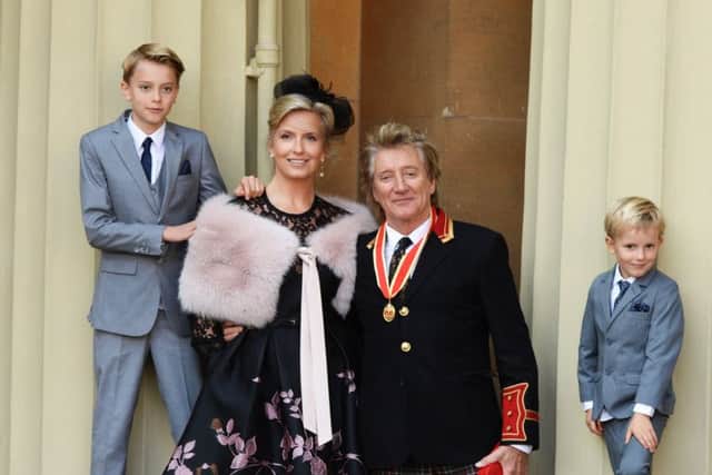 Veteran singer Sir Rod Stewart at Buckingham Palace in London, with his wife, Penny Lancaster and children Alastair Stewart and Aiden. Picture:  Shutterstock