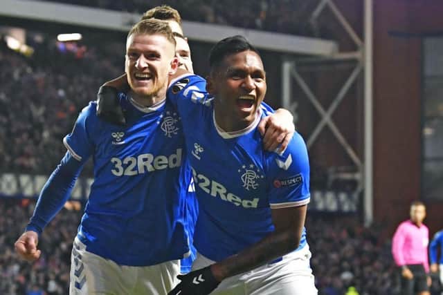Rangers' Steven Davis celebrates with Alfredo Morelos after the midfielder scored his side's second goal during the Europa League Group G match against Porto at Ibrox. Picture: Rob Casey/SNS Group
