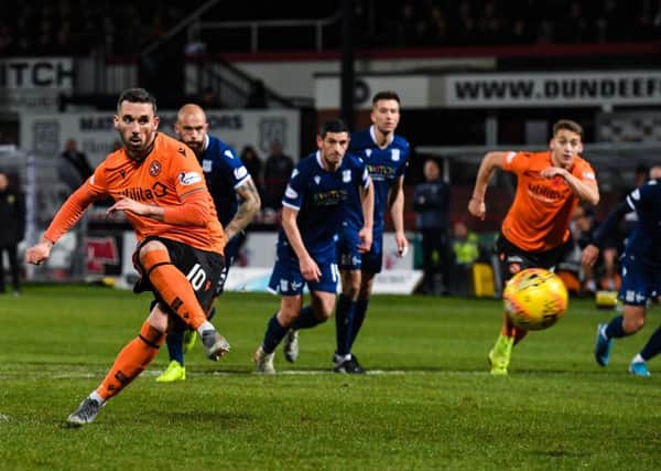 Dundee United's Nicky Clark scores a penalty to make it 1-0. Picture: Alan Harvey / SNS