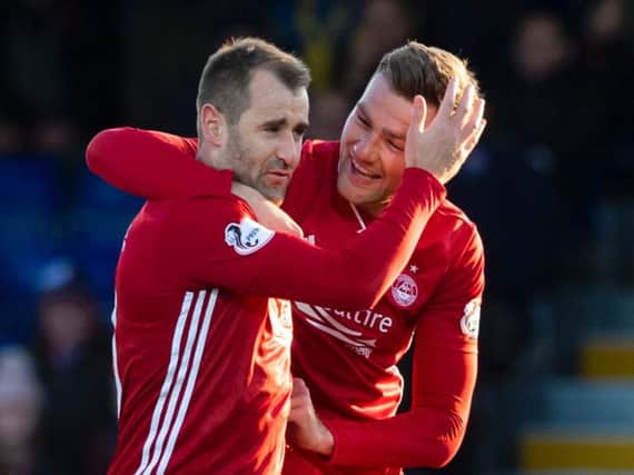Niall McGinn and Mikey Devlin celebrate Aberdeen's equaliser