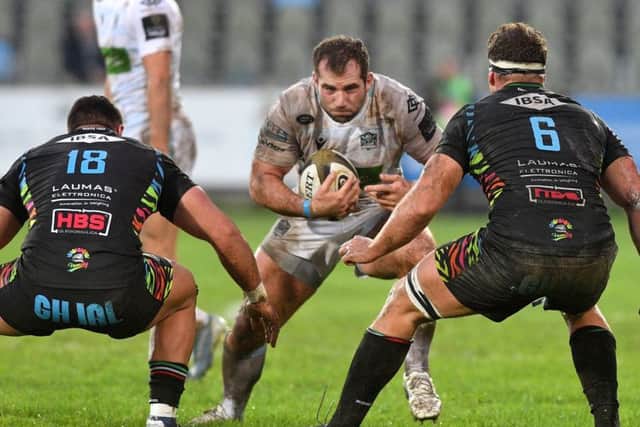 Fraser Brown looks for a way past or through Zebres Giosue Zilocchi and Giovanni Licata at the Stadio Sergio Lanfranchi.  Photograph: Luca Sighinolfi/INPHO/Shutterstock