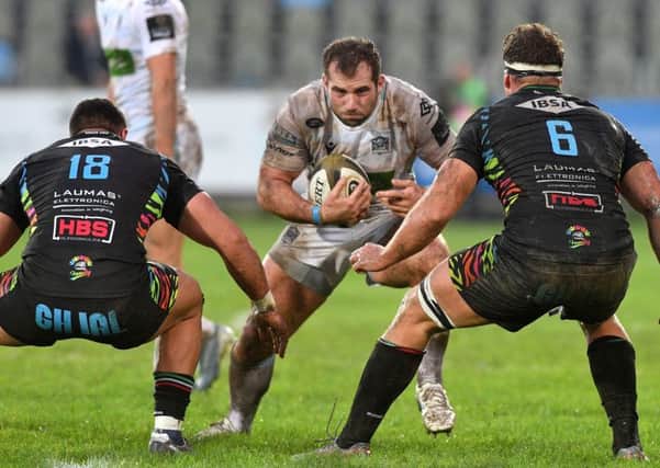 Fraser Brown looks for a way past or through Zebres Giosue Zilocchi and Giovanni Licata at the Stadio Sergio Lanfranchi.  Photograph: Luca Sighinolfi/INPHO/Shutterstock