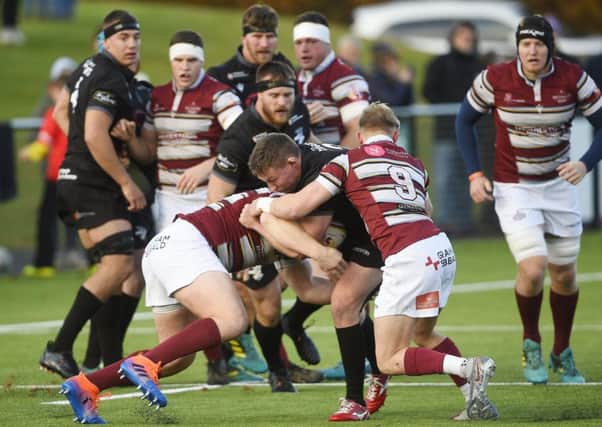 Russell Anderson of Southern Knights runs into 
Watsonians' Roan Frostwick. Picture: Greg Macvean