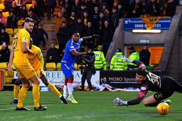 Alfredo Morelos squeezes his low shot into the far corner to secure the points for Rangers. Picture: SNS