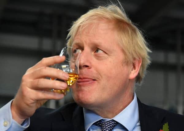 Prime Minister Boris Johnson breaks his alcohol ban in Scotland by tasting whisky during his recent visit to Diageo's Roseisle Distillery. Picture: Daniel Leal-Olivas/Getty Images
