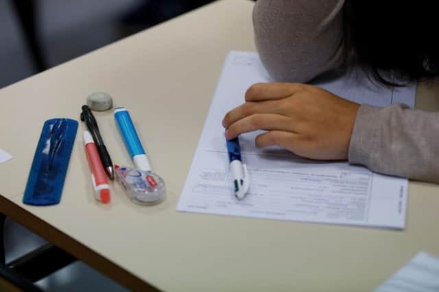 A high school student gets ready to sit an exam