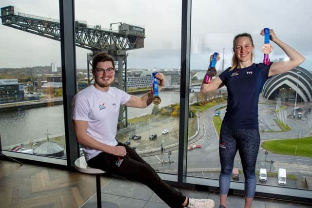 Scott McLay and Hannah Miley reveal the official medals for Glasgow 2019, the LEN European Short Course Swimming Championships. Picture: SNS.