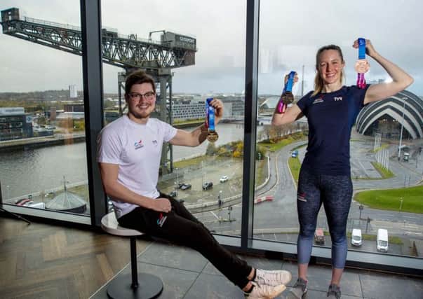 Scott McLay  and Hannah Miley reveal the official medals for Glasgow 2019, the LEN European Short Course Swimming Championships. Picture: SNS.