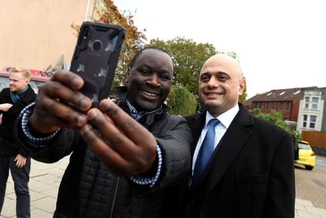 Chancellor of the Exchequer Sajid Javid poses for a selfie as he visits the area of his former home at Stapleton Road in Bristol (Photo by Finnbarr Webster/Getty Images)
