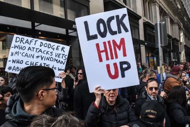 Anti-Trump protesters have started using "Lock him up", a repurposing of one of his slogans, "Lock her up", in reference to Hillary Clinton's email usage during her time as Secretary of State (Picture: Stephanie Keith/Getty Images)