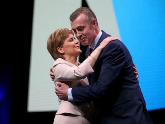 Nicola Sturgeon embraces Plaid Cymru leader Adam Price after he spoke at the SNP conference in October 2018. Picture: PA