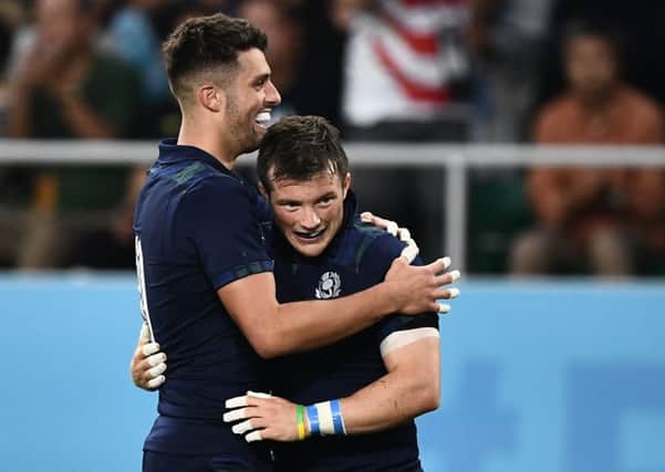 George Horne, right, celebrates his World Cup try against Russia with Adam Hastings. The pair have made a big impact on their return. Picture: AFP/Getty
