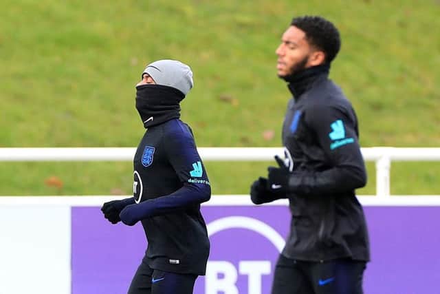 England's Raheem Sterling and Joe Gomez during a training session at St George's Park. Picture: Mike Egerton/PA Wire.