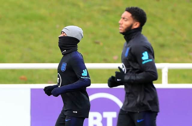 England's Raheem Sterling and Joe Gomez during a training session at St George's Park. Picture: Mike Egerton/PA Wire.