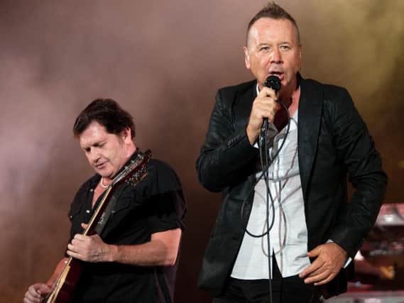 Simple Minds vocalist Jim Kerr performs with guitarist Charlie Burchill. Picture: GettyImages