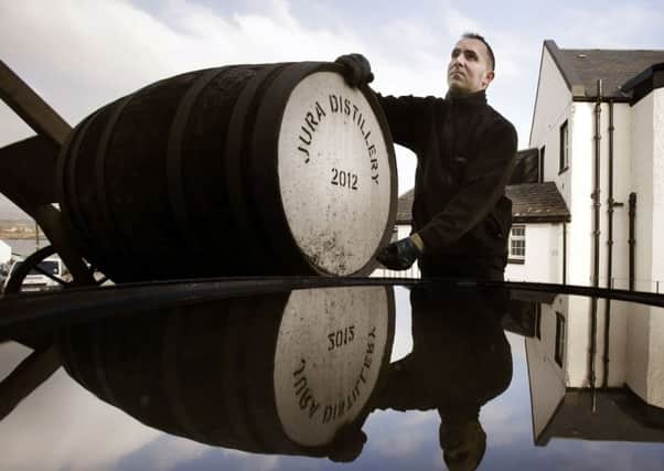 Warehouseman Graham Rozga at the Jura whisky distillery on the Scottish island Jura. Master blenders from across the globe will meet in Scotland next month in search of the year's top whisky