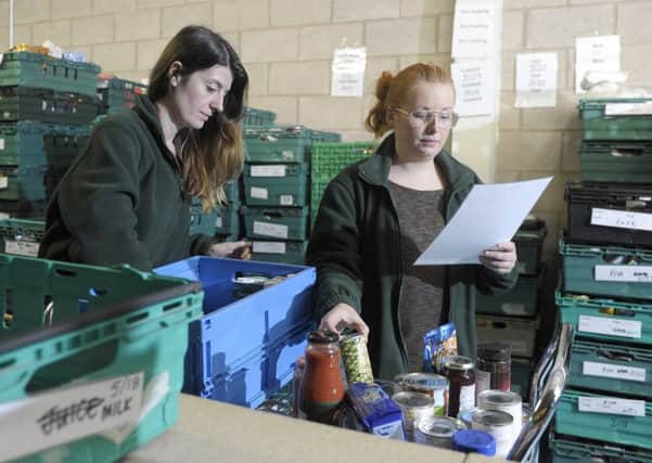 Staff at food banks report one of the main reasons people are referred is a delay to benefit payments (Picture: Neil Hanna)