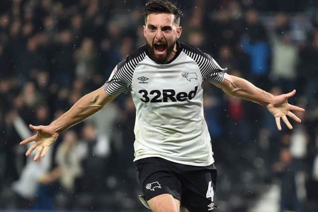 Graeme Shinnie celebrates a goal for Derby County against Wigan in the English Championship. Picture: Nathan Stirk/Getty