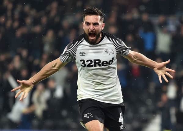 Graeme Shinnie celebrates a goal for Derby County against Wigan in the English Championship. Picture: Nathan Stirk/Getty