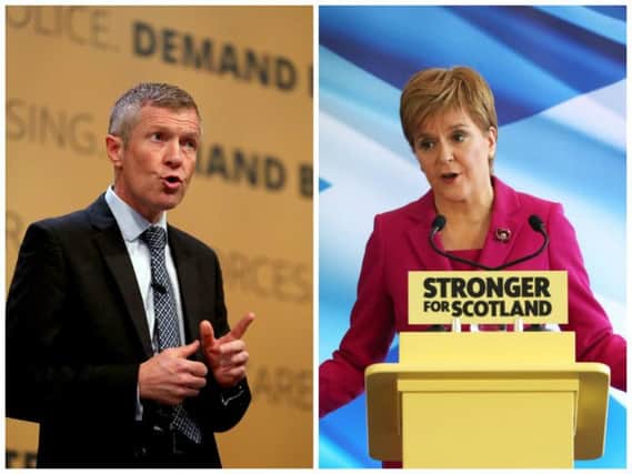 Scottish Liberal Democrats leader Willie Rennie challenged the First Minister over an apparent rise in the number of police sick days due to mental illness. Picture: PA