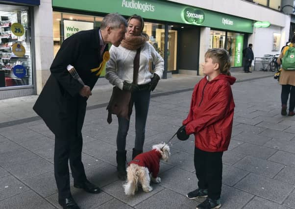 Willie Rennie canvassing for the Lib Dems yesterday in the Newkirkgate shopping centre in Leith . Picture: Lisa Ferguson