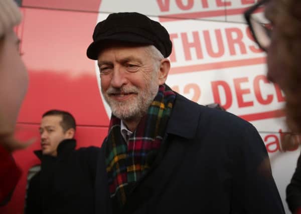 Jeremy Corbyn campaigns in Linlithgow, wearing a cap rather than a fez (Picture: David Cheskin/Getty Images)