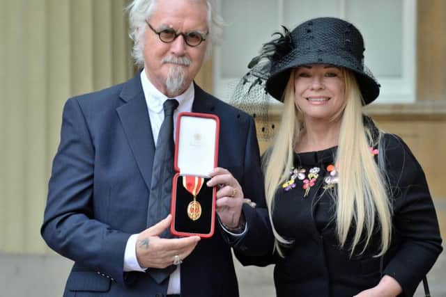 Connolly with Pamela, receiving his knighthood in 2017