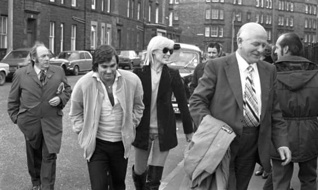 George Best and wife Angie with Hibs chairman Tom Hart at Easter Road in November 1979.