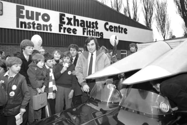 Fans greet George Best as he arrives to open the Euro Exhaust Centre in Edinburgh in January 1980.