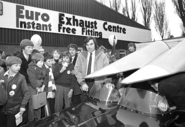 Fans greet George Best as he arrives to open the Euro Exhaust Centre in Edinburgh in January 1980.