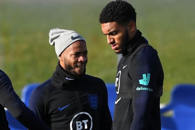 Raheem Sterling, left, and Joe Gomez at training ahead of the England v Montenegro match. Photograph: Michael Regan/Getty.