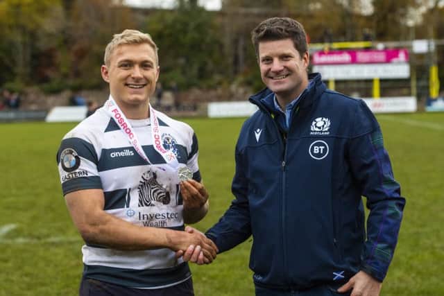 Iain Wilson receives his Man of the Match award from Scottish Rugbys chief operating officer Dom McKay.  following Heriots victory over Ayrshire Bulls last week. Photograph: Gary Hutchison/SNS/SRU.