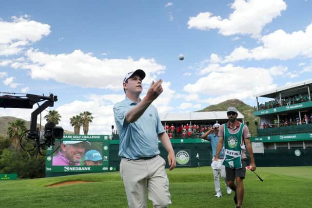Bob MacIntyre throws his ball into the crowd after carding a seven-under-par 65 in the third round of the Nedbank Challenge in Sun City. Picture: Getty Images