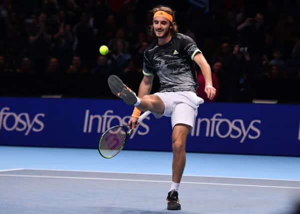Stefanos Tsitsipas kicks the ball as he celebrates victory against Switzerland's Roger Federer. Picture: AFP/Getty