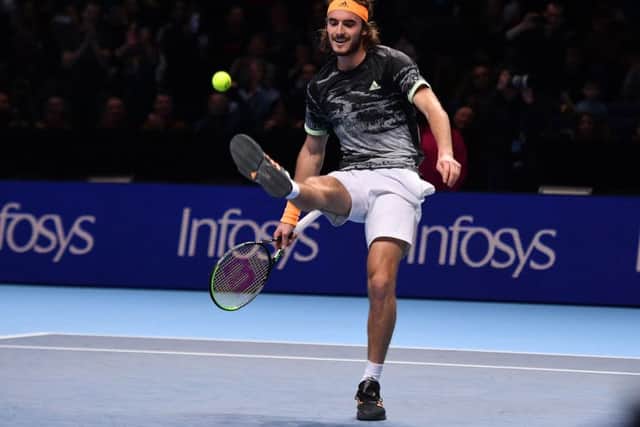Stefanos Tsitsipas kicks the ball as he celebrates victory against Switzerland's Roger Federer. Picture: AFP/Getty