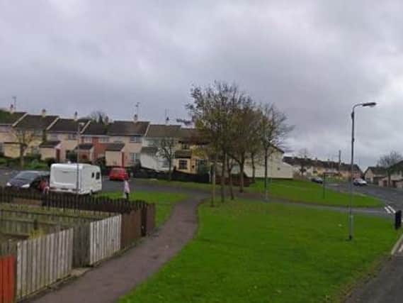 The PSNI said a gang forced entry into the property at Trasna Way on Saturday at around 9.15pm and attacked a woman and girl inside.