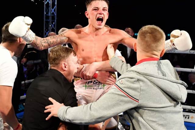 Lee McGregor celebrates with his team after beating Kash Farooq on a split decision at the Emirates Arena. Picture: Paul Devlin/SNS