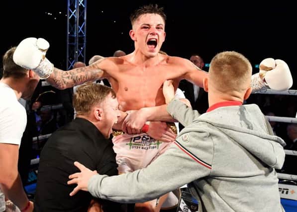 Lee McGregor celebrates with his team after beating Kash Farooq on a split decision at the Emirates Arena. Picture: Paul Devlin/SNS