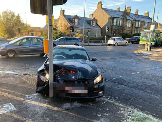 The BMW crashed into a set of traffic lights,
