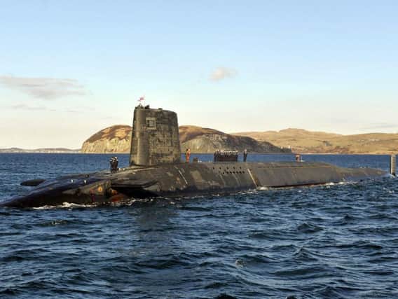 A Trident Submarine leaves the Faslane base on Scotland's west coast