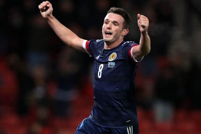 John McGinn celebrates scoring Scotlands third goal against Kazakhstan. Picture: PA.