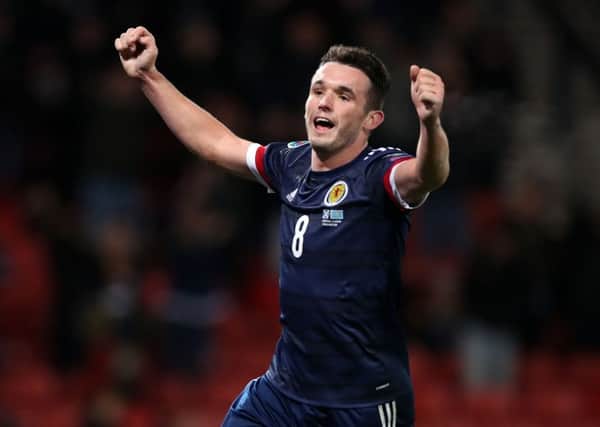 John McGinn celebrates scoring Scotlands third goal against Kazakhstan. Picture: PA.