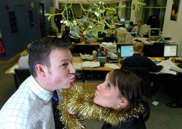 Hang on a minute! Kissing, at the office party? Surely not (Picture: Cate Gillon)