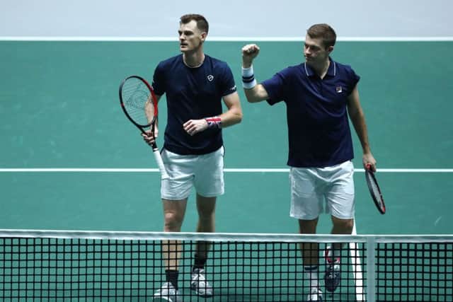 Jamie Murray and Neal Skupski approach the net after clinching victory over Alexander Bublik and Mikhail Kukushkin. Picture: Getty.