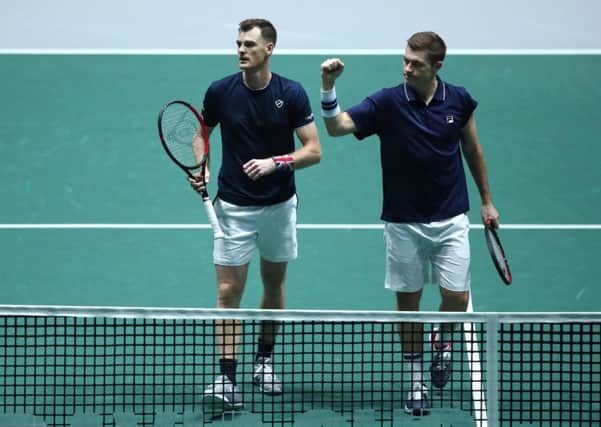 Jamie Murray and Neal Skupski approach the net after clinching victory over Alexander Bublik and Mikhail Kukushkin. Picture: Getty.
